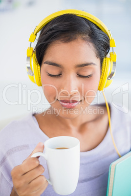 Smiling woman listening to headphones Smiling woman listening to headphones