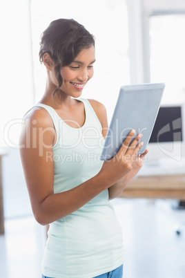 Casual brunette showing tablet computer