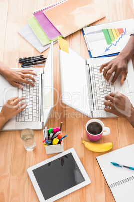 Young business people working at the laptops