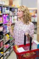 Pretty blonde woman buying a products