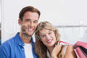 Portrait of a happy couple with shopping bags