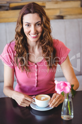 Young woman having a coffee