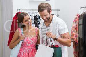 Smiling couple with shopping bags