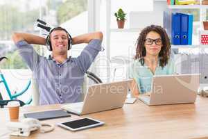 Relaxed businessman listening to music