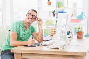 Young creative businessman working on the computer