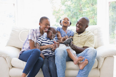 Happy smiling family on the couch