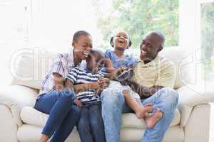 Happy smiling family on the couch