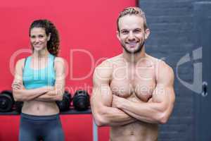 Muscular couple looking at the camera