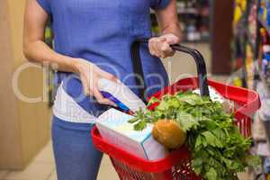 Woman putting product in basket