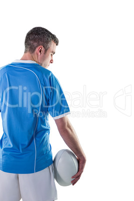 Rugby player holding a rugby ball