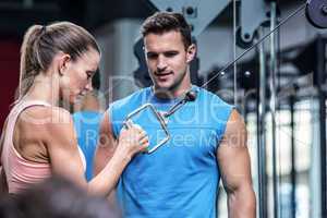 Young Bodybuilder training a young woman