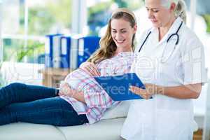 Female doctor talking to a pregnant woman