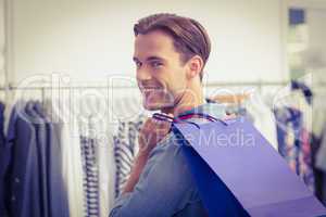 Portrait of a smiling man with shopping bags