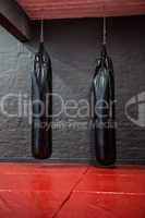 Two punching bags in red bowing area