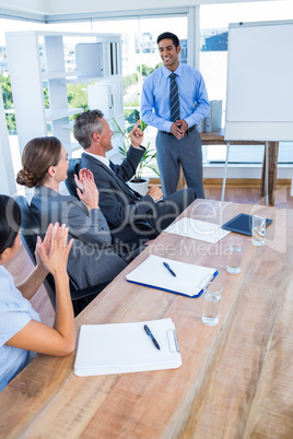 Business people applauding during a meeting