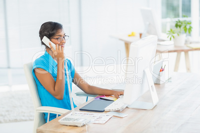 Casual designer working at her desk