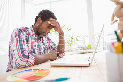 Young businessman thinking about something