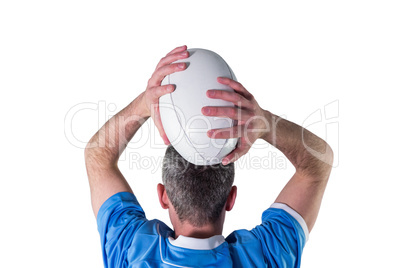 Rugby player about to throw a rugby ball