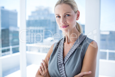 Thoughtful businesswoman standing in the office