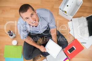 Young creative businessman working on tablet