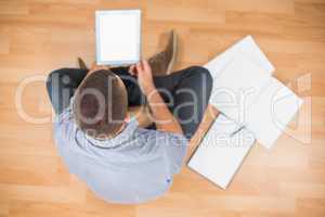Young creative businessman working on tablet
