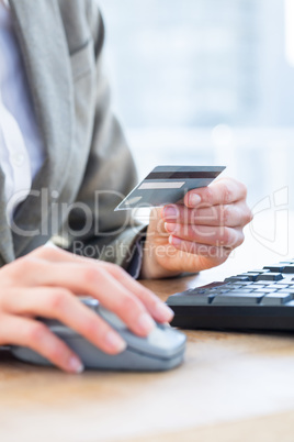 Businessman pay with her credit card on internet