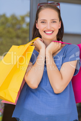 Happy woman carrying shopping bags