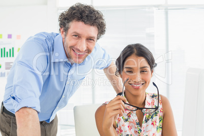 Portrait of a smiling casual young couple at work