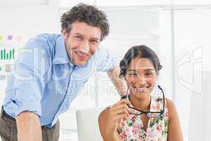 Portrait of a smiling casual young couple at work