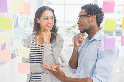 Young creative business people talking to each other