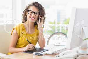 Smiling young businesswoman on the phone