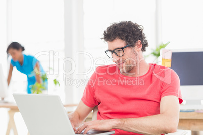 Man posing in front of his colleague