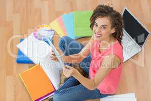 Young creative businesswoman holding a tablet