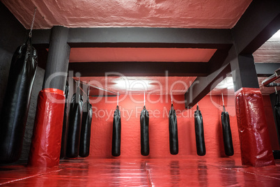 Red boxing area with punching bags