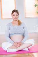 Pregnant woman looking at camera