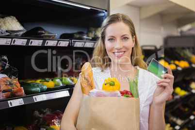 A pretty blonde with a grocery bag