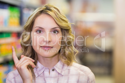 Portrait of a smiling pretty woman looking at camera and lift he