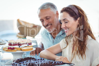 Cute couple looking at pastries