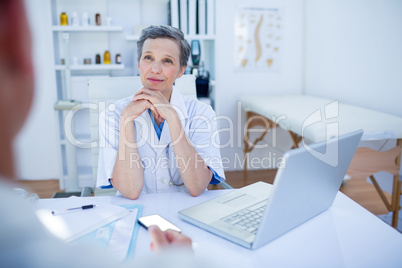 Female doctor speaking with her patient