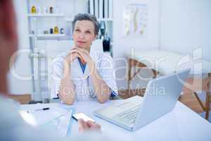 Female doctor speaking with her patient