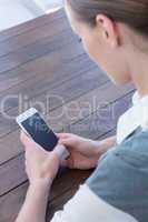 Close up view of businesswoman using her smartphone