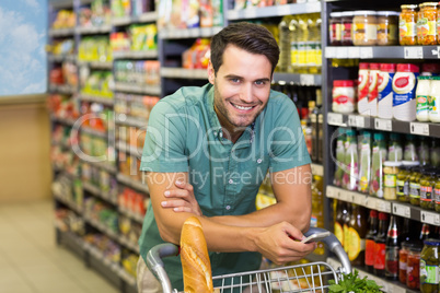 Portrait of smiling man buy food and using his smartphone