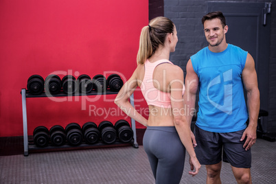 Two young smiling Bodibuilder talking to each other