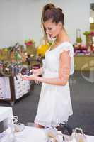 Smiling woman looking at high-heeled sandals