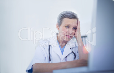 Female doctor using her laptop computer