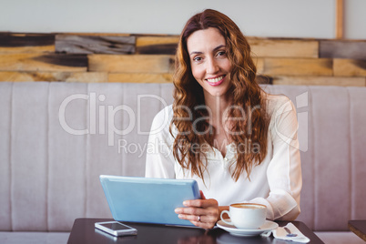 Woman using digital tablet