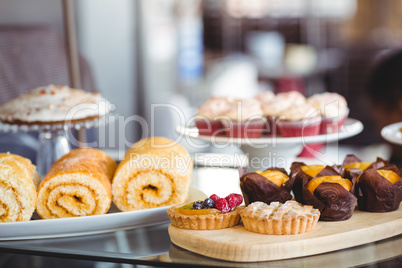 Close up of pastries on plates on counter