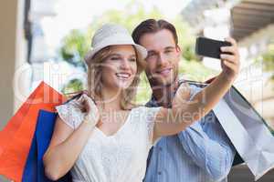 Cute smiling couple taking a selfie