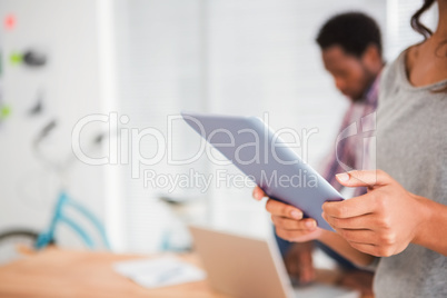 Young businesswoman holding a tablet