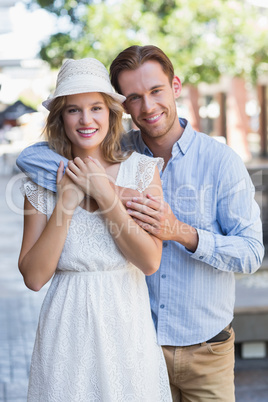 Standing cute couple looking at the camera